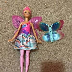 Barbie dreamtopia comes with two flying spinners